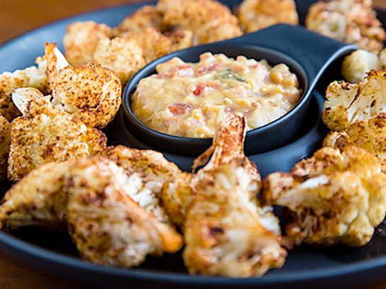 Vegan Appetizers That Make Your Guests Line Up For More-Roasted Cauliflower Bites with Nacho Cheese