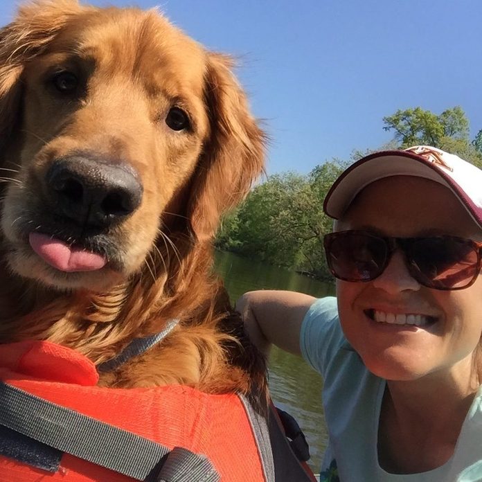 Selfie of woman with her dog on a boat
