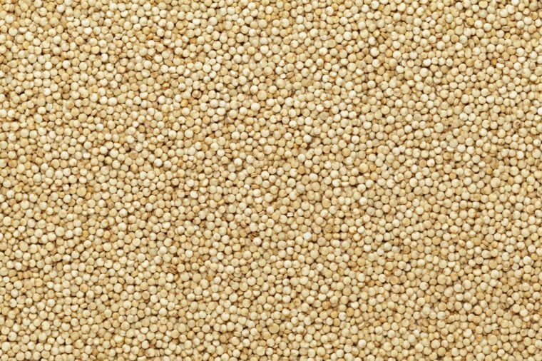 Organic Quinoa (Chenopodium quinoa) seeds Macro close up background texture. Top view.