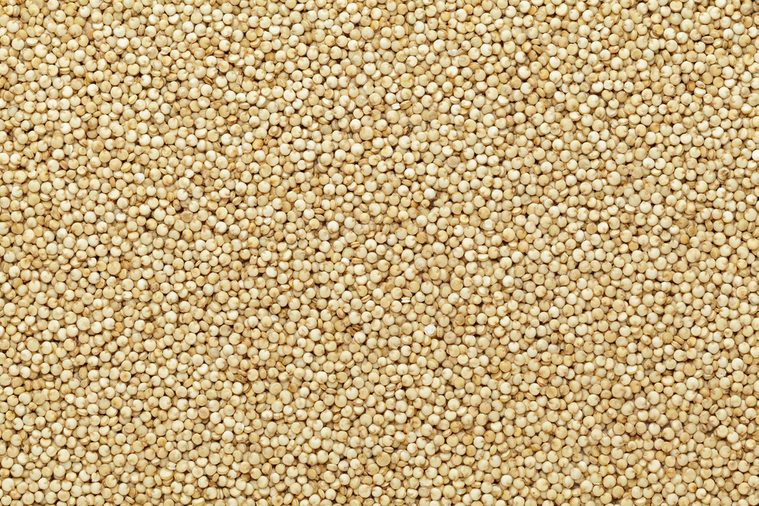Organic Quinoa (Chenopodium quinoa) seeds Macro close up background texture. Top view.