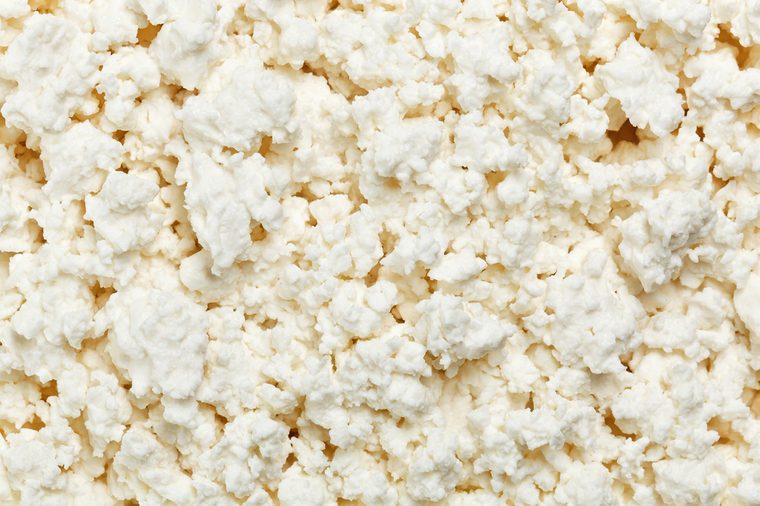 Cottage cheese (curd) top view, food background
