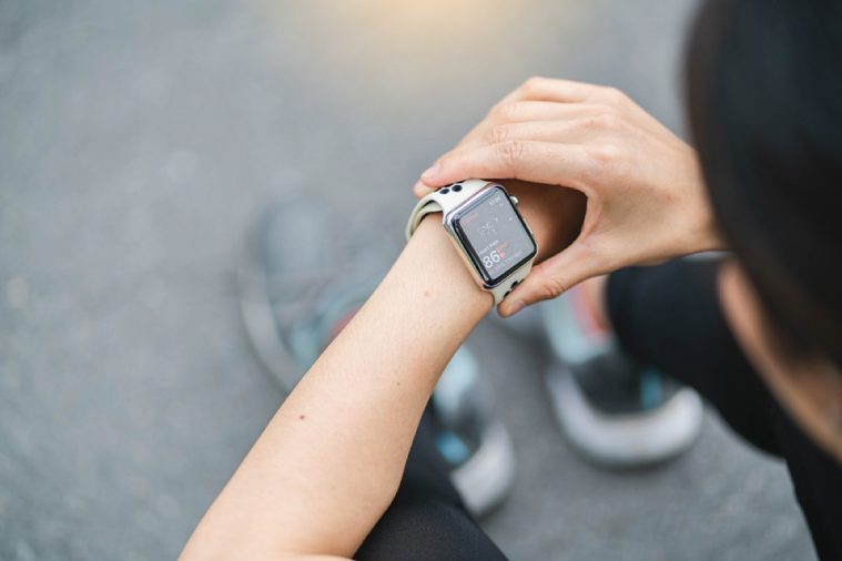 Woman check Heart rate app on Apple Watch After Working out
