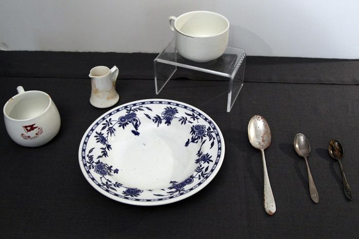 China and spoons from the RMS Titanic Inc. are on display at Guernsey's Auctioneers & Brokers, in New York. The auction of more than 5,000 Titanic artifacts a century after the luxury liner's sinking has stirred hundreds of interested calls, with some offering to add to the dazzling trove already plucked from the ocean floor