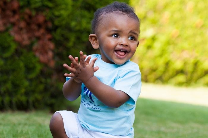Portrait of a little african american baby boy playing outdoor in the grass