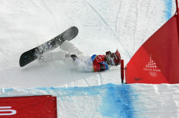 Mandatory Credit: Photo by Lionel Cironneau/AP/Shutterstock (6392064d) JACOBELLIS American Lindsey Jacobellis who was leading in the final of the Women's Snowboard Cross competition, crashes in sight of the finish at the Turin 2006 Winter Olympic Games in Bardonecchia, Italy, . Tanja Frieden of Switzerland won the race to take the gold medal, Jacobellis finished second to take the silver medal, and Dominique Maltais of Canada bronze WINTER OLYMPICS SNOWBOARD CROSS USA TR1, BARDONECCHIA, Italy