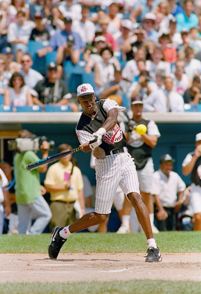Mandatory Credit: Photo by John Swart/AP/Shutterstock (6564145a) Chicago Bull's basketball player Michael Jordan swings during a celebrity softball game, at Comiskey Park in Chicago. Jordan and a group of his friends played Michael Bolton and his band before the start of the Chicago White Sox and Milwaukee Brewers game Michael Jordan Baseball, Chicago, USA