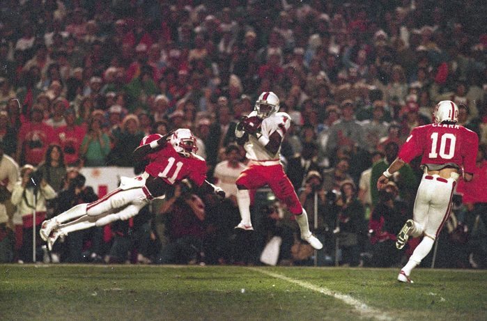 Mandatory Credit: Photo by John Raoux/AP/Shutterstock (6569113a) University of Miami wide receiver Stanley Shakespeare (6) leaps high to gather a first quarter pass from quarterback Bernie Kosar against the University of Nebraska in the Orange Bowl game in Miami, . Flying through the air to defend is Nebraska cornerback Neil Harris (11 Orange Bowl Miami Nebraska 1984, Miami, USA