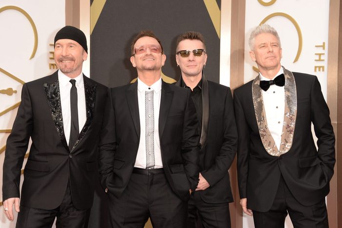 (L-R) Musicians The Edge, Bono, Larry Mullen Jr. and Adam Clayton of U2 attend the Oscars March 2, 2014