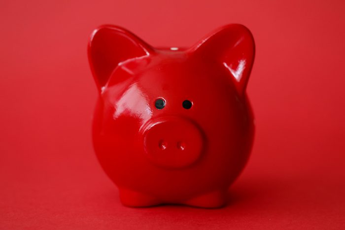 red piggy bank on red background