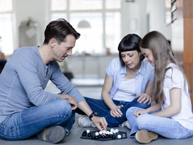 Family playing chess