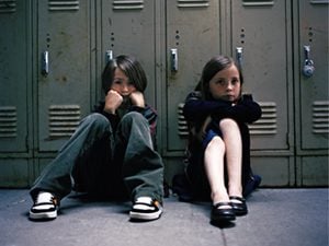 kids sitting by the lockers