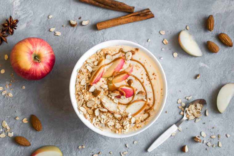 bowl of oatmeal with cinnamon. apples, and almonds
