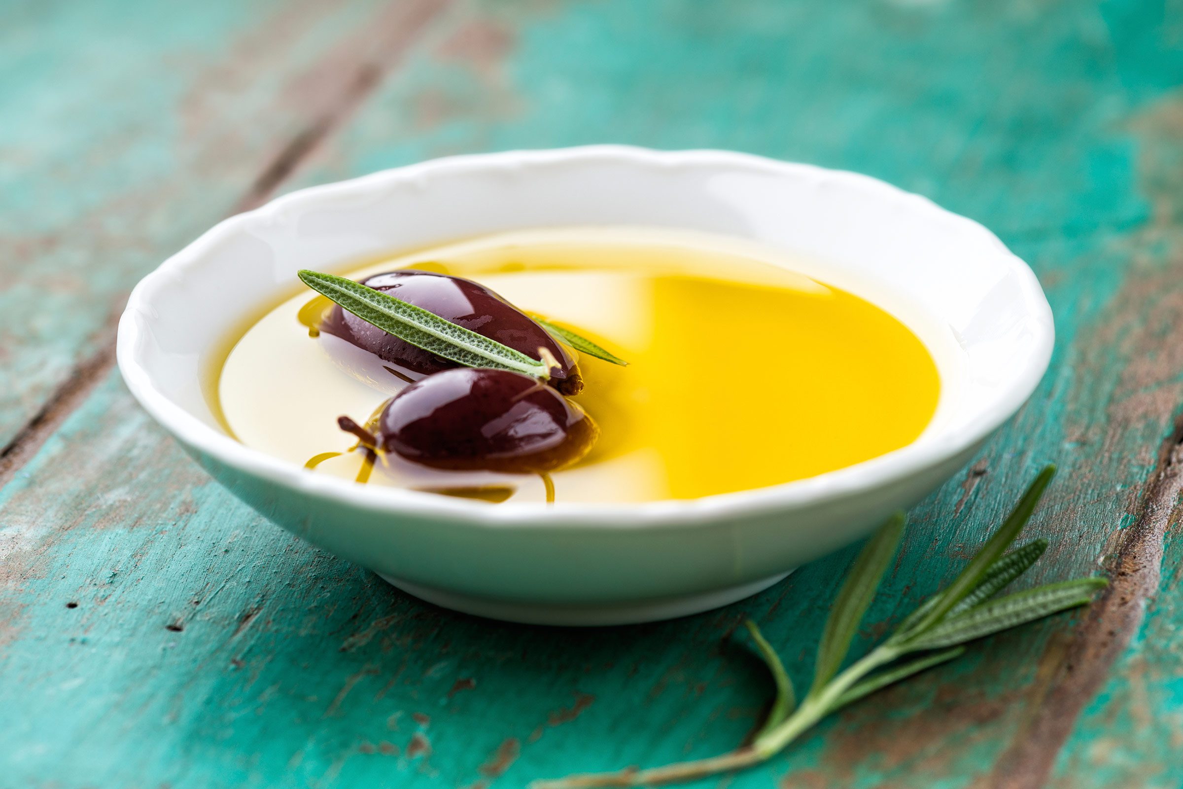 olives in dish with olive oil