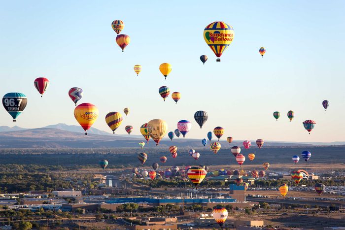 a large gathering of hot air balloons above Albuquerque in New Mexico