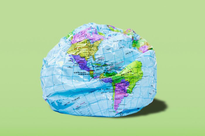 deflated globe on a green background