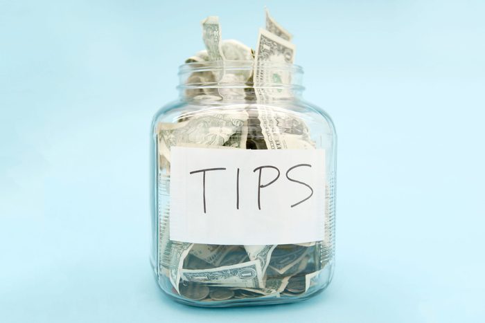 tip jar with USD on a light blue background