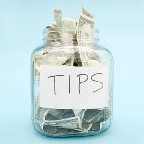 tip jar with USD on a light blue background