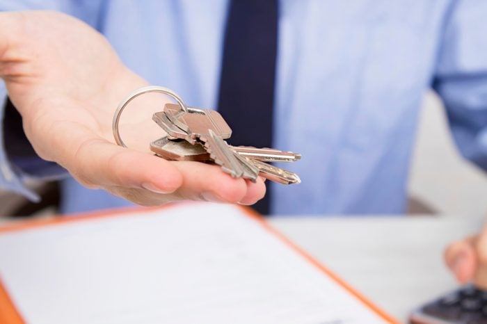 closeup of hands with keys of house, to buy house