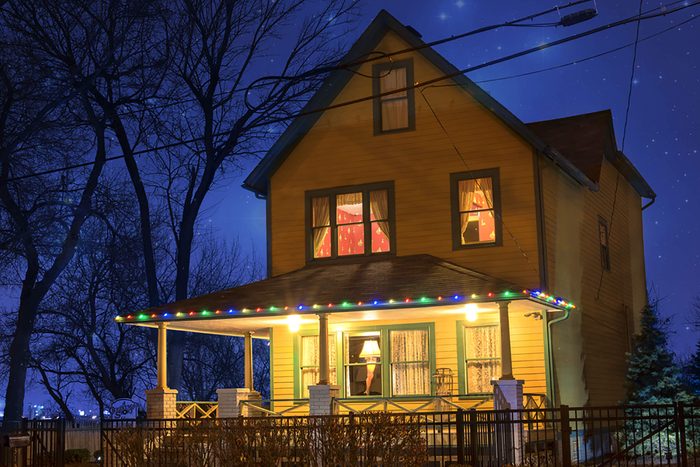 A scene from A Christmas Story of a house lit up at night