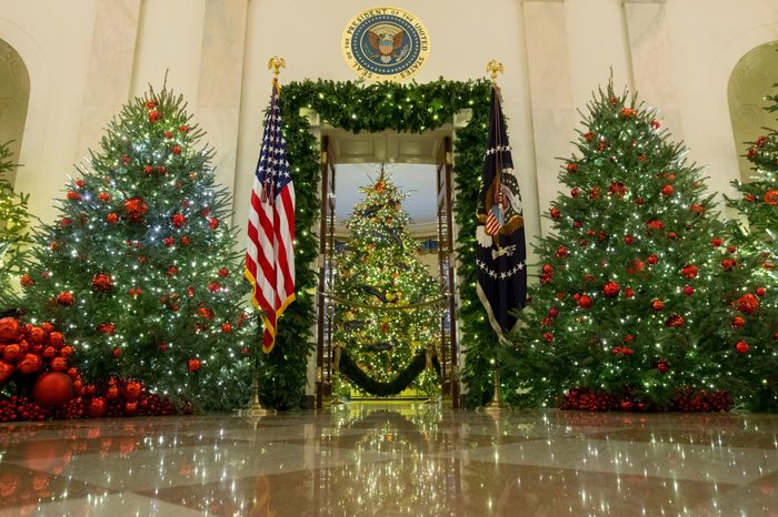 Presidential seal is seen above an entrance to the Blue Room where the official White House Christmas tree is