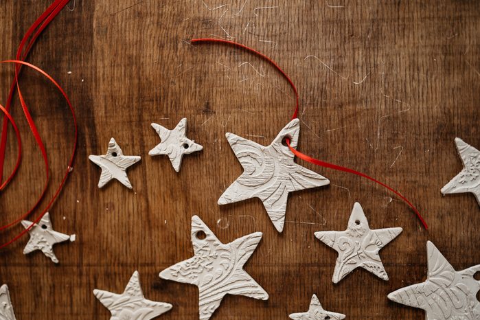 DIY clay star ornaments on rustic table
