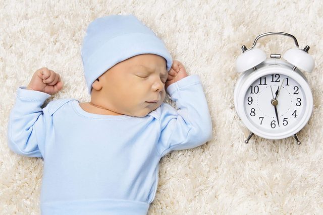 baby with clock