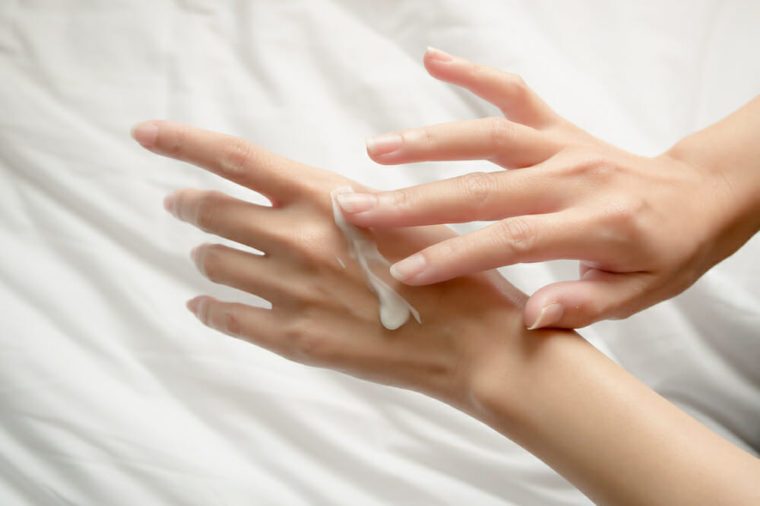 Beautiful woman hands with cream