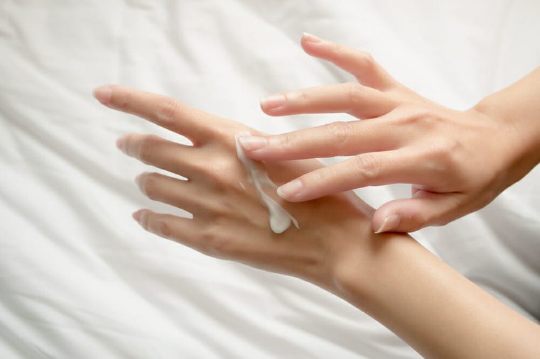 Beautiful woman hands with cream