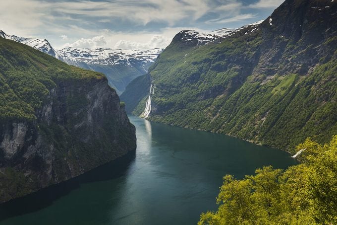 Seven Sisters waterfall. Geiranger fjord view from Road Of The Eagles mountain serpentine. Scenic Norway nature landscape. 