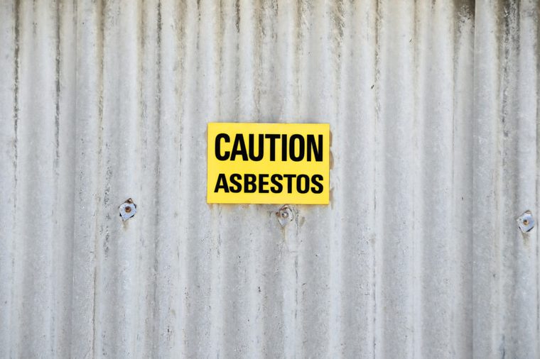 Sign with text: Caution asbestos