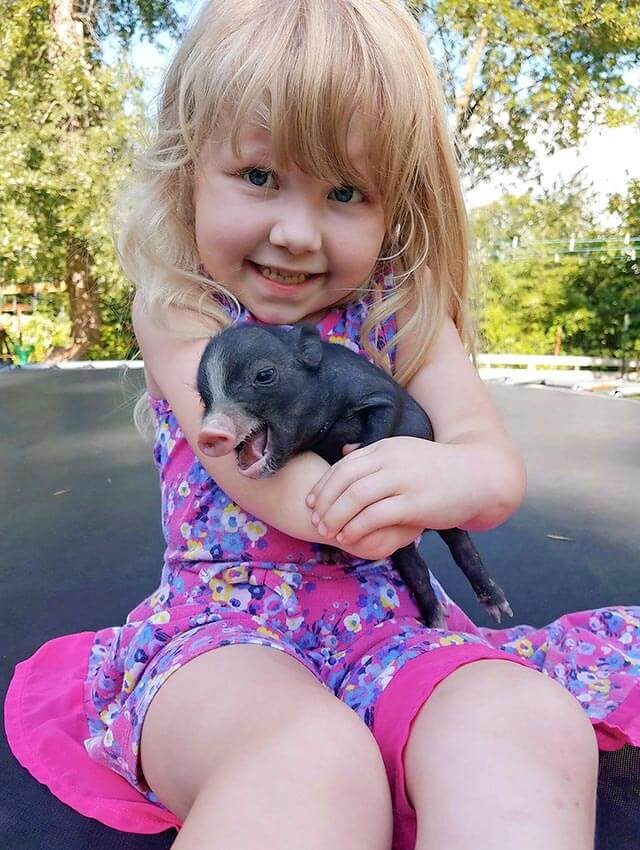 Girl-with-baby-pig