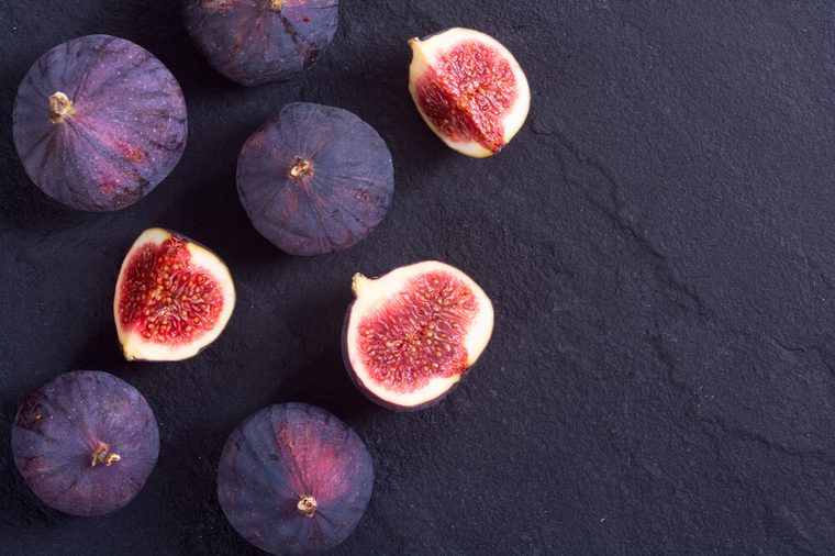 Ripe sweet figs . Healthy mediterranean fig fruit . Top view , space for text