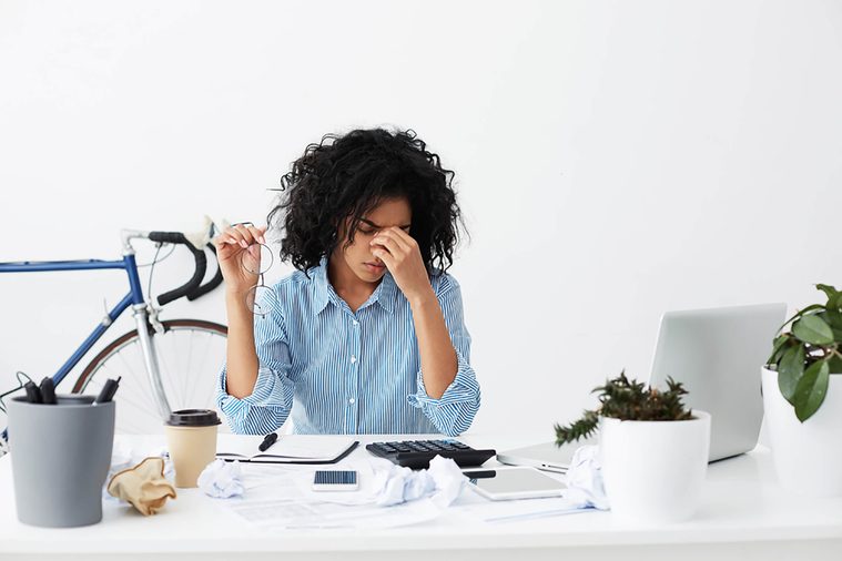 stressed-woman at her desk