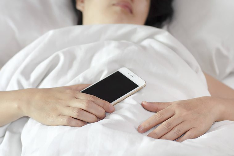 Woman-sleeping-with-phone