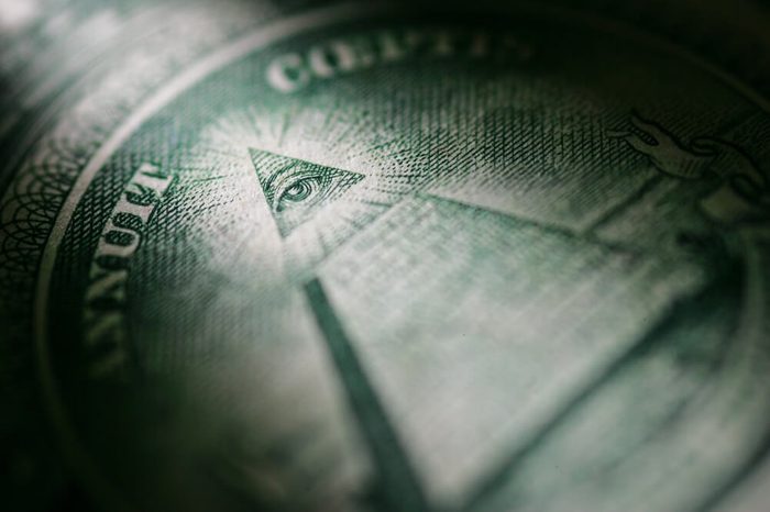Selectively highlighted detail of the One Dollar Bill from the United States of America showing the Pyramid and the All Seeing Eye 