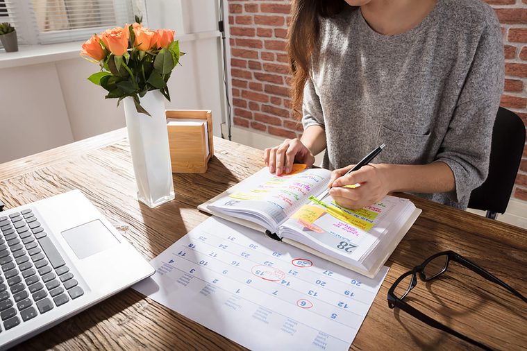 woman working on her planning schedule