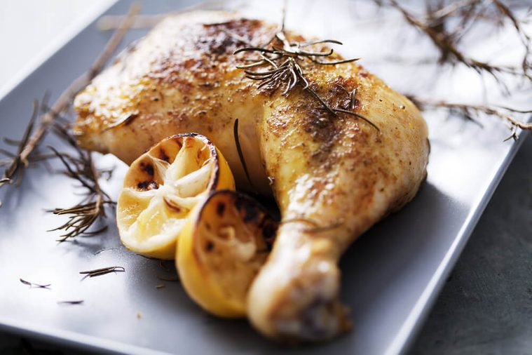 roast chicken leg with cooked with rosemary and served with green beans