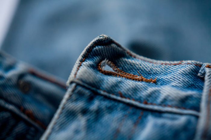 jeans button hole closeup fashion denim background