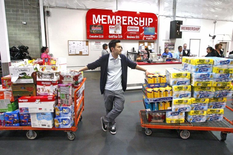 David Lee holds on to his carts while shopping at a Costco Wholesale store, in Portland, Ore. The Commerce Department said Wednesday, May 9, 2012, that wholesale stockpiles increased 0.3 percent in March, just one-third of the 0.9 percent rise in February. Sales in March were up 0.5 percent, about half the 1.1 percent sales gain in February