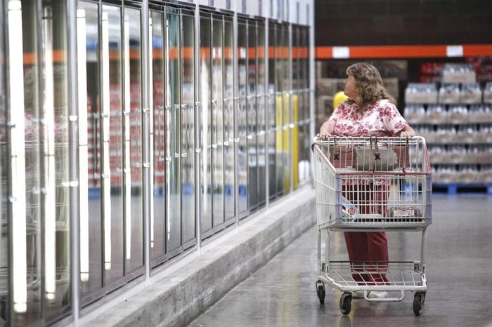 A shopper looks for grocery food items at Costco in Auburn Hills, Mich