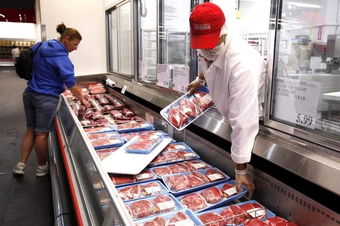 A Costco butcher puts out beef at Costco in Mountain View, Calif. Wholesale prices rose last month for the second straight month as the cost of energy climbed enough to offset an unexpected drop in food prices