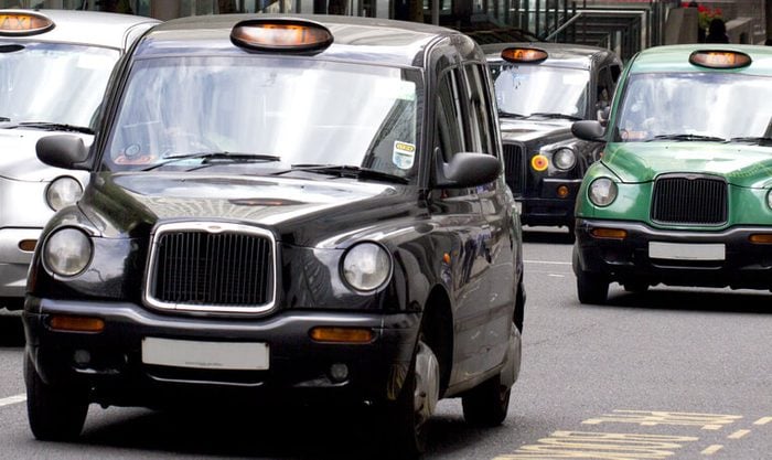 Five London Taxi Cabs in Canary Wharf (licence plate numbers removed)