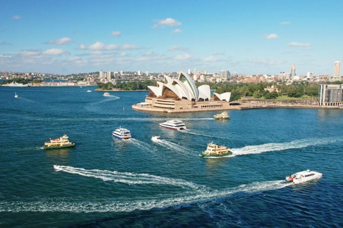 Sydney opera house with ferrys in foregournd, taken from harbor bridge