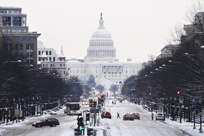 View down Pennsylvania Avenue to the United States Capitol during a winter snow storm.