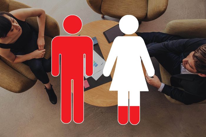 overhead view of business discussion with man and woman symbols overlay