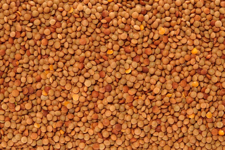 Red Lentils Surface Texture Top View Close up. Pattern Background