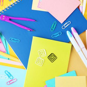 Colorful stationery on yellow background