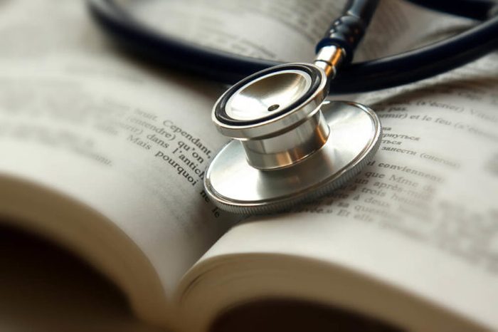 Stethoscope on open book isolated