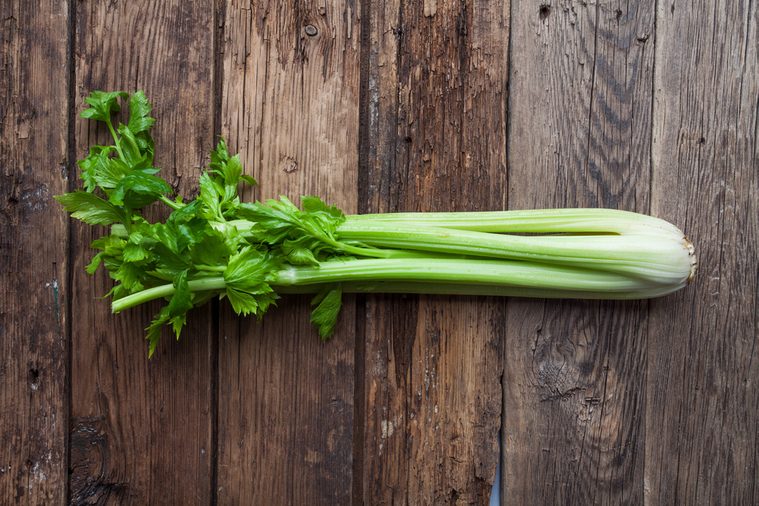 fresh celery on old rustic background