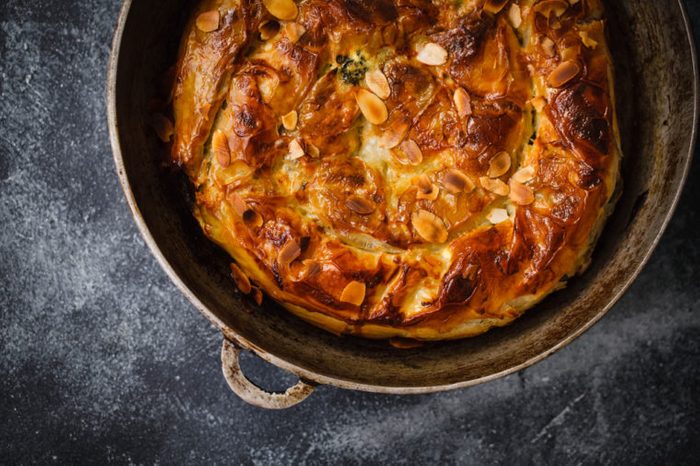 Greek style filo pastry pie round overhead comfort food